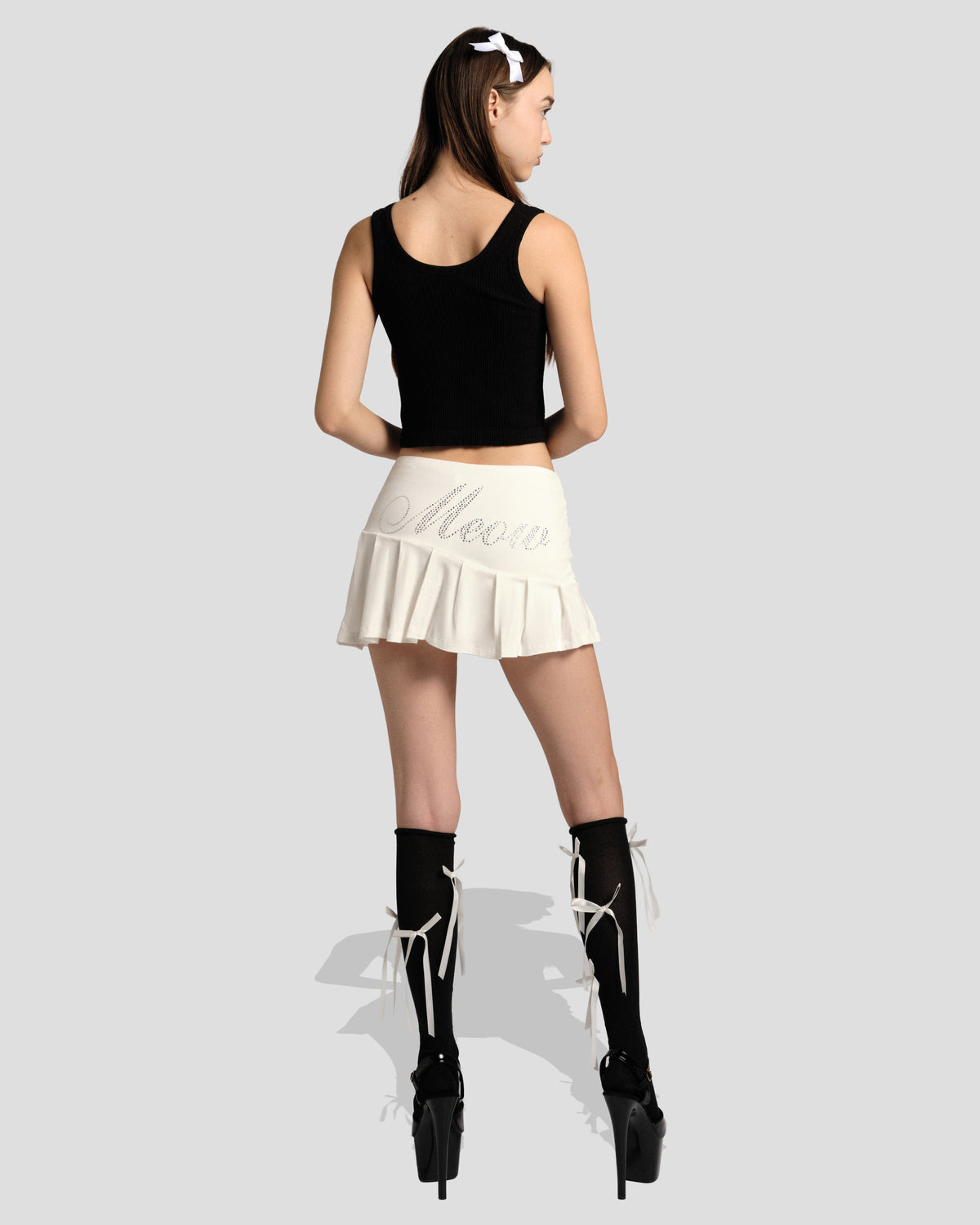 Feral Spell Knife Pleat Skirt, full-length back view