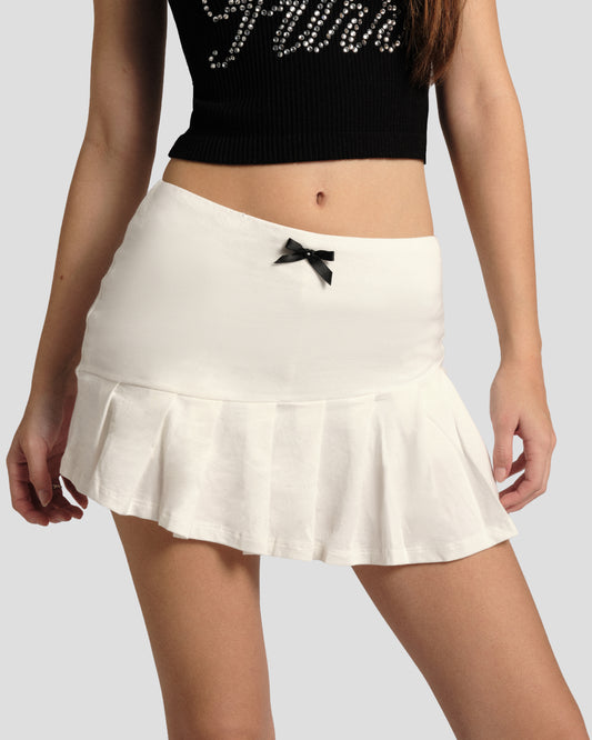 Feral Spell Knife Pleat Skirt in Off-White: pleated mini with black bow at the waist, front close-up