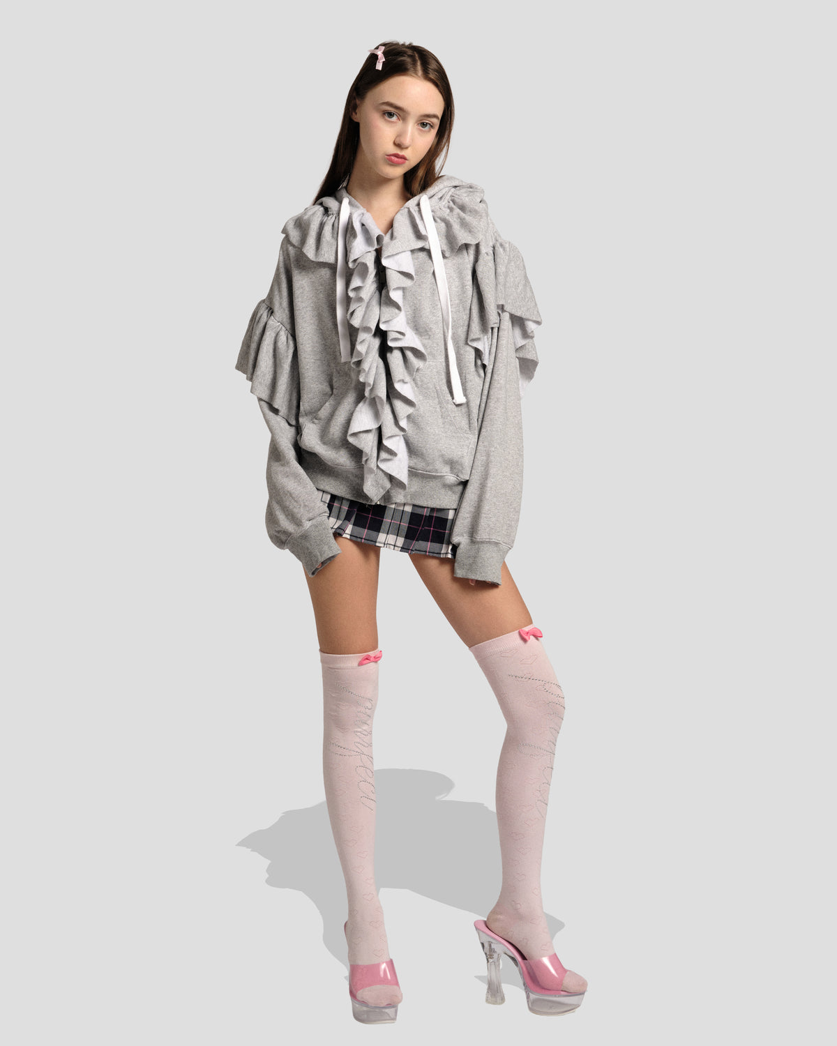 The Kitty Senshi Ruffle Zip Hoodie in Heather Grey: white ruffle trim down the zip and shoulders, full-length front view