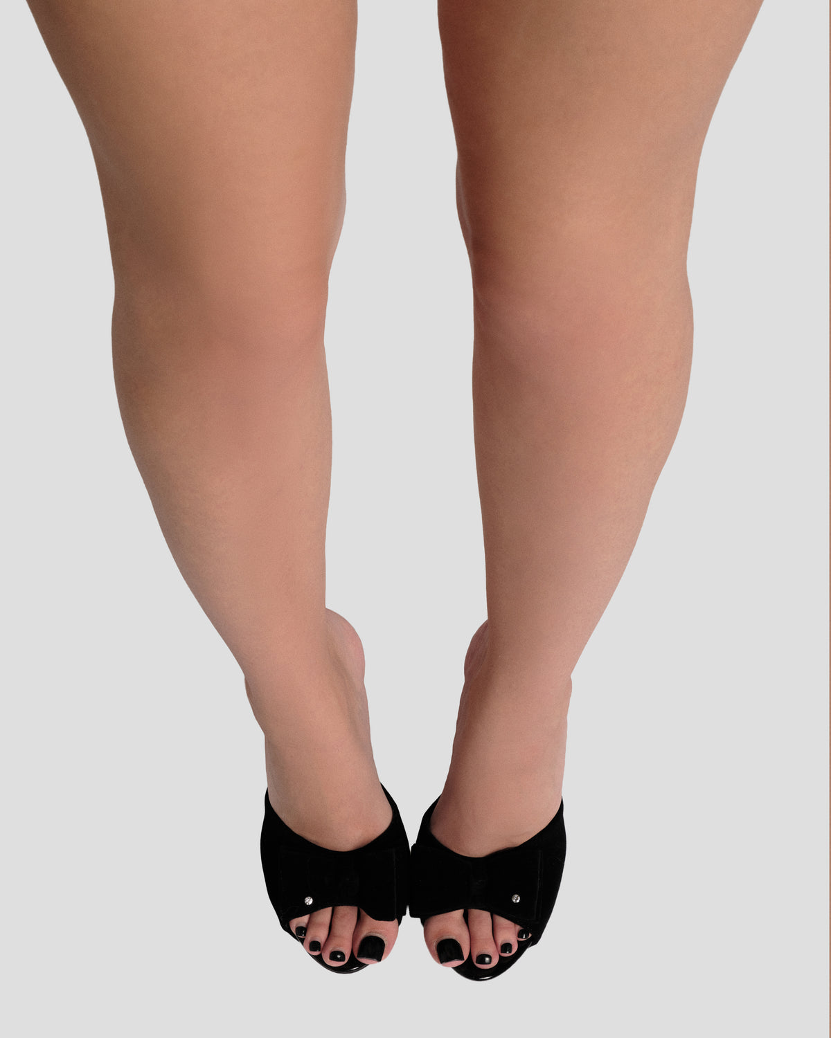 Bow Platform Mule Heel in Black Velvet, front view of both shoes